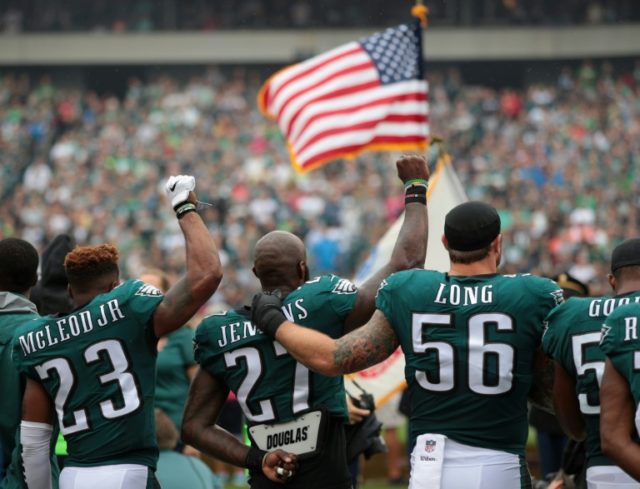 Philadelphia Eagles players stand during the National Anthem on October 8, 2017 in Philadelphia, Pennsylvania