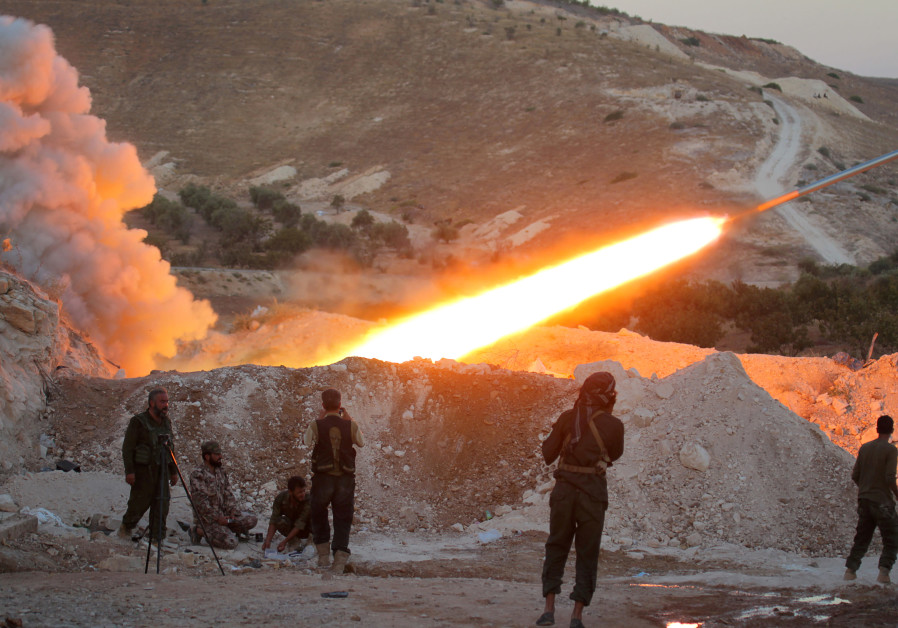 Free Syrian Army fighters launch a Grad rocket from Halfaya town in Hama province, towards forces loyal to Syria's President Bashar Assad stationed in Zein al-Abidin mountain, Syria September 4, 2016. Photo By: REUTERS/AMMAR ABDULLAH/FILE PHOTO rebels