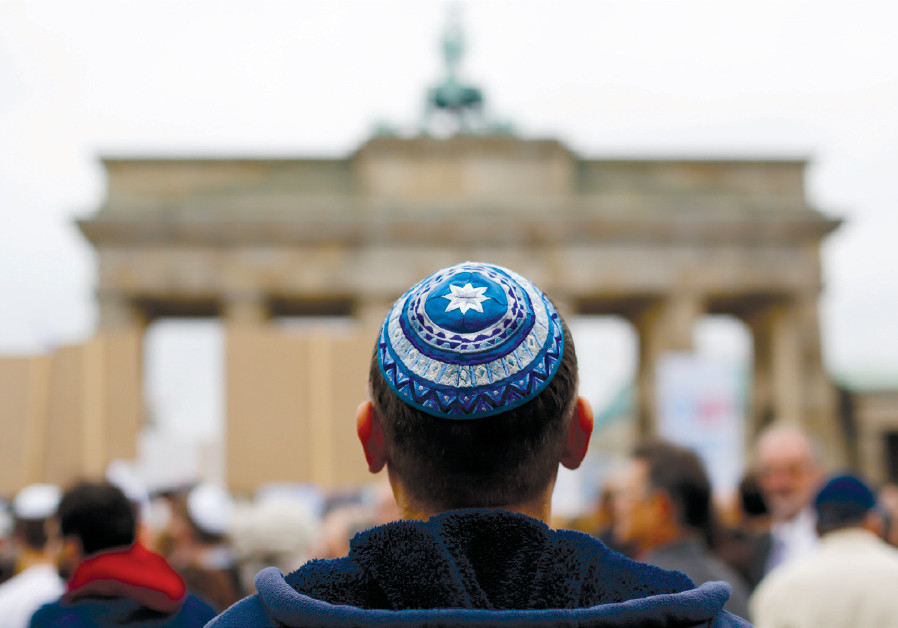 A MAN wearing a kippa waits for the start of a demonstration against antisemitism at Berlin’s Brandenburg Gate in 2014 Photo By: THOMAS PETER/REUTERS A MAN wearing a kippa waits for the start of a demonstration against antisemitism at Berlin’s Brande
