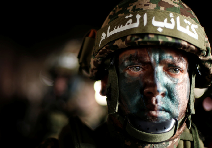A Palestinian Hamas militant takes part in a rally marking the 30th anniversary of Hamas' founding, in Gaza City December 14, 2017 Photo By: SUHAIB SALEM / REUTERS A Palestinian Hamas militant takes part in a rally marking the 30th anniversary of Hamas' founding i