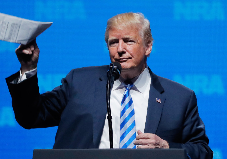 U.S. President Donald Trump gestures before he speaks at a National Rifle Association (NRA) convention in Dallas Photo By: LUCAS JACKSON / REUTERS Trump in Dallas:'You know what causes nuclear war? Weakness'