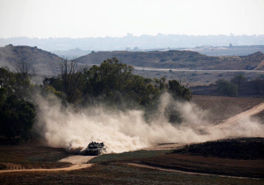 An Israeli tank drives on the Israeli side of the border between Israel and Gaza Photo By: AMIR COHEN/REUTERS White House condemns ‘destructive violence’ of Gaza volleys