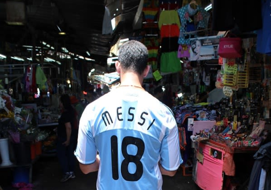 Argentina fan Remy Friedman at the market in Tel Aviv Photo By: RUTY KOROTAEV Argentina fan Remy Friedman at the market in Tel Aviv