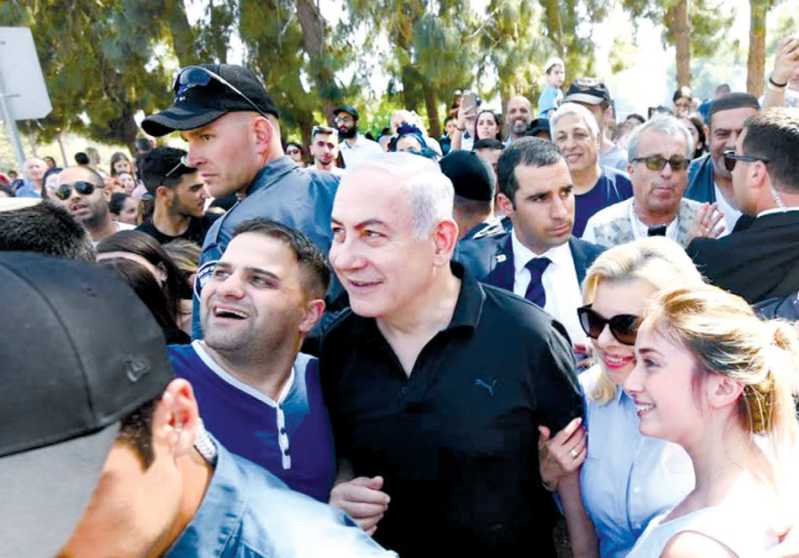 PRIME MINISTER Benjamin Netanyahu and his wife, Sara, join the public in the Wohl Rose Garden, opposite the Knesset, on Independence Day Photo By: GPO Channel 10 News: If elections held today, Netanyahu would win