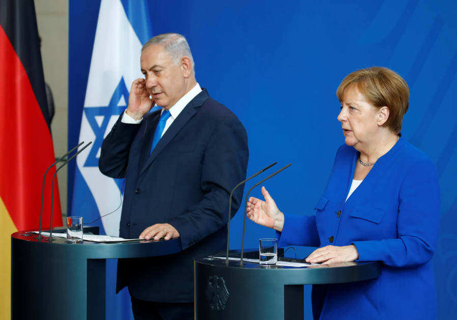 German Chancellor Angela Merkel gestures during a news conference with Israeli Prime Minister Benjamin Netanyahu in Berlin Photo By: AXEL SCHMIDT/REUTERS Merkel: Germany will exert its influence to push Iran out of Syria