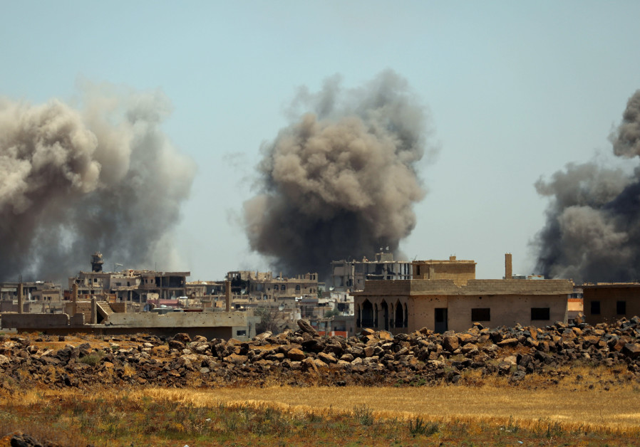 Smoke rises from al-Harak town, as seen from Deraa countryside, Syria June 25, 2018. Photo By: ALAA AL-FAQIR Smoke rises from al-Harak town, as seen from Deraa countryside, Syria June 25, 2018.