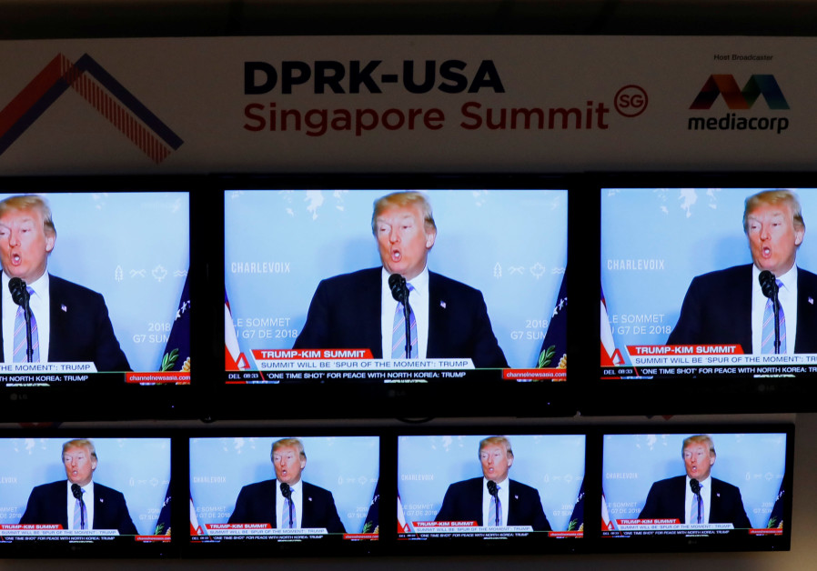 A TV news reports about U.S. President Donald Trump is projected on TV sets at a media center for the summit between the U.S and North Korea in Singapore Photo By: REUTERS/KIM KYUNG-HOON A TV news reports about U.S. President Donald Trump is projected on TV sets at a media center for th