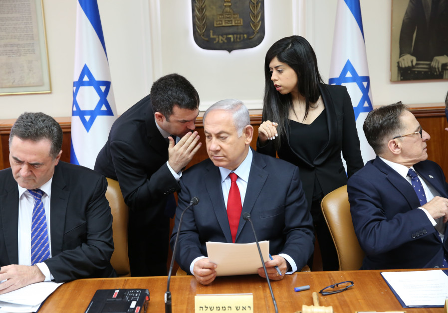 Prime Minister Benjamin Netanyahu whispering in cabinet government meeting on July 23, 2018 Photo By: ALEX KOLOMOISKY / POOL Prime Minister Benjamin Netanyahu whispering in cabinet government meeting on July 23, 2018