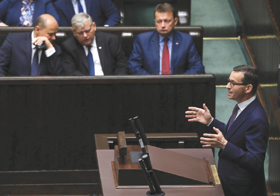 Poland’s Prime Minister Mateusz Morawiecki speaks during the debate about the Holocaust legislation in the lower house of Parliament in Warsaw on June 27, 2018 Photo By: AGENCJA GAZETA VIA REUTERS Poland’s Prime Minister Mateusz Morawiecki speaks during the debate about the Holocaust legislation