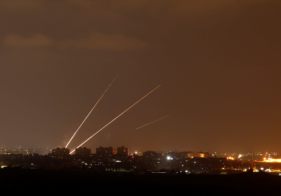 Streaks of light are pictured as rockets are launched from the northern Gaza Strip towards Israel, as seen from Sderot, Israel August 8, 2018. Photo By: AMIR COHEN - REUTERS Rockets are launched from the northern Gaza Strip towards Israel, Israel August 8, 2018.