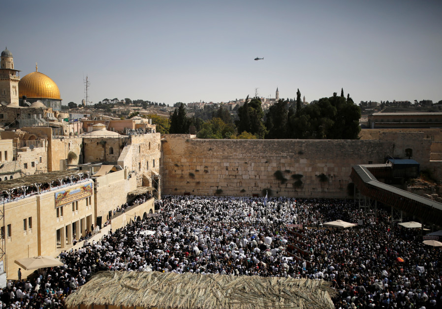 A general view shows Jewish worshippers at the Western Wall, Judaism's holiest prayer site, in Jerusalem's Old City Photo By: REUTERS/AMIR COHEN A general view shows Jewish worshippers at the Western Wall, Judaism's holiest prayer site, in Jerus