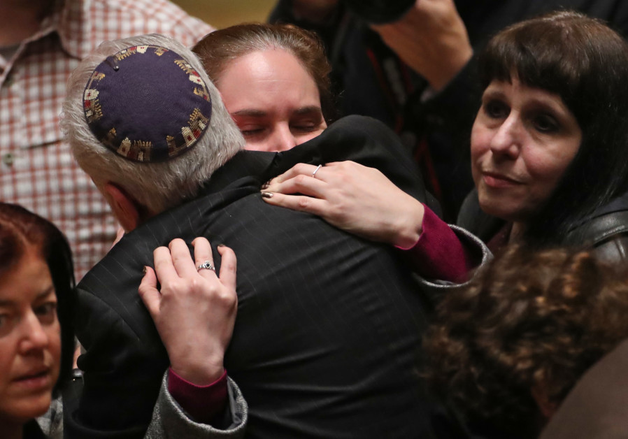 Mourners react during a memorial service at the Sailors and Soldiers Memorial Hall of the University of Pittsburgh, a day after 11 worshippers were shot dead at a Jewish synagogue in Pittsburgh, Pennsylvania, October 28, 2018 Photo By: CATHAL MCNAUGHTON/REUTERS Mourners react during a memorial service at the Sailors and Soldiers Memorial Hall