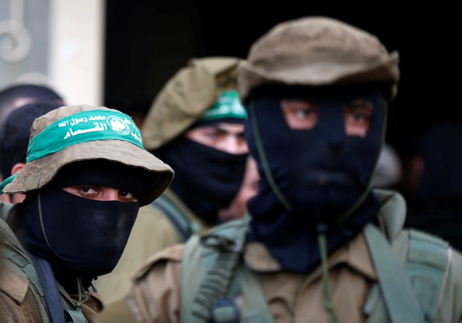 Hamas militants attend the funeral of members of Palestinian security forces loyal to Hamas, in the central Gaza Strip March 22, 2018. Photo By: REUTERS/MOHAMMED SALEM Shin Bet thwarts planned Hamas terror attacks against Israeli targets