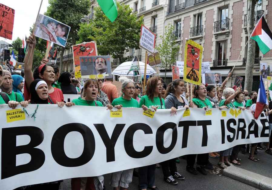 Protesters hold abanner that reads "Boycott Israel" during a pro-Palestinian demonstration in Paris Photo By: AFP PHOTO / DOMINIQUE FAGET Protesters hold abanner that reads "Boycott Israel" during a pro-Palestinian demonstration in Paris