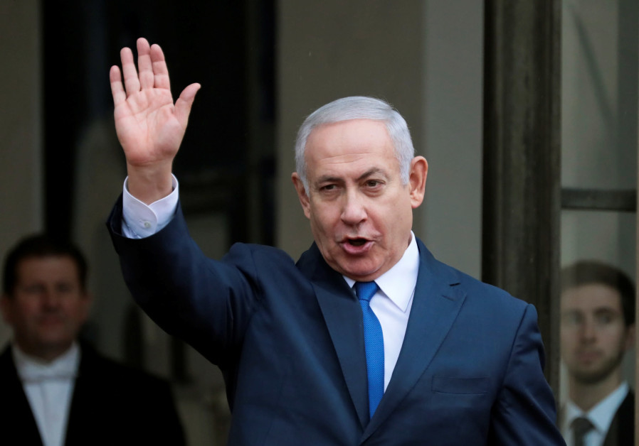 Israeli Prime Minister Benjamin Netanyahu waves as he arrives at the Elysee Palace after the commemoration ceremony for Armistice Day, 100 years after the end of World War One, in Paris, France, November 11, 2018 Photo By: REINHARD KRAUSE/REUTERS Benjamin Netanyahu