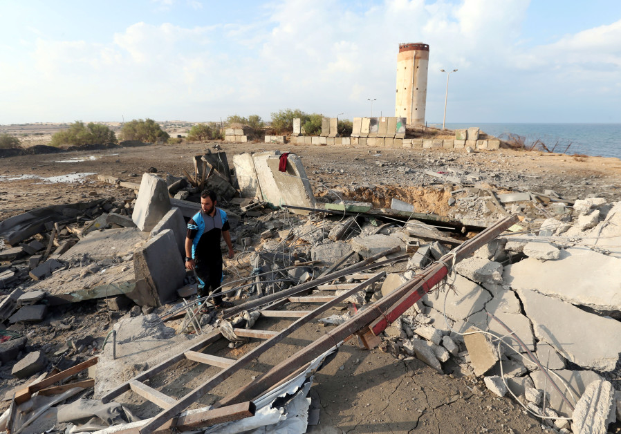 A Palestinian man inspects the scene of an Israeli air strike on a Hamas security forces site in the southern Gaza Strip October 17, 2018 Photo By: IBRAHEEM ABU MUSTAFA / REUTERS A Palestinian man inspects the scene of an Israeli air strike on a Hamas security forces site in the