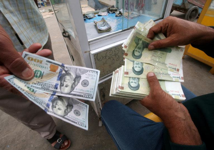 Iranian rials, U.S. dollars and Iraqi dinars at a currency exchange shop in Basra, Iraq, November 3, 2018. Picture taken November 3, 2018. Photo By: REUTERS/ESSAM AL-SUDANI Iranian rials, U.S. dollars and Iraqi dinars at a currency exchange shop in Basra, Iraq, November 3,