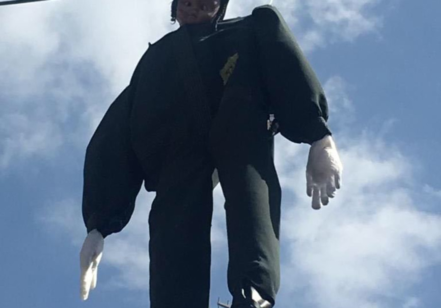 A hanging doll dressed up as a Haredi soldier was removed by the police in Jerusalem on Friday, March 2, 2018 (Police spokesperson) Photo By: POLICE SPOKESPERSON'S UNIT Agudah: We'll bring down government ‘the moment’ enlistment law passes