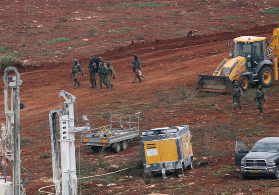 Israeli soldiers walk together as seen from the village of Kfar Kila, in south Lebanon December 4, 2018. Photo By: REUTERS/ALI HASHISHO Israeli soldiers walk together as seen from the village of Kfar Kila, in south Lebanon
