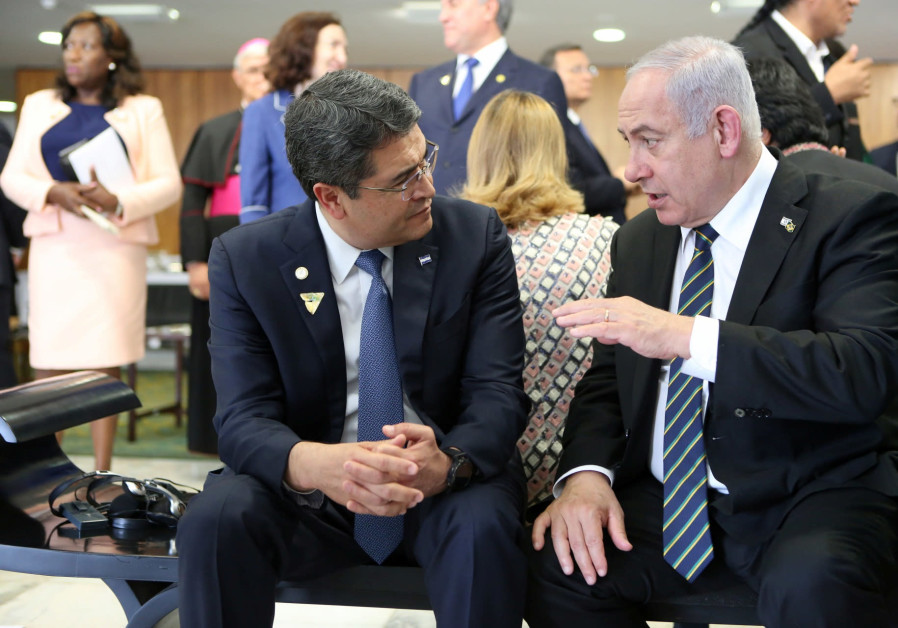 Israeli Prime Minister Benjamin Netanyahu speaks with Honduras' President Juan Orlando Hernandez during a meeting in Brasilia, Brazil January 1, 2019. Photo By: PRESIDENCY HONDURAS/HANDOUT VIA REUTERS Israeli Prime Minister Benjamin Netanyahu speaks with Honduras' President Juan Orlando Hernandez dur