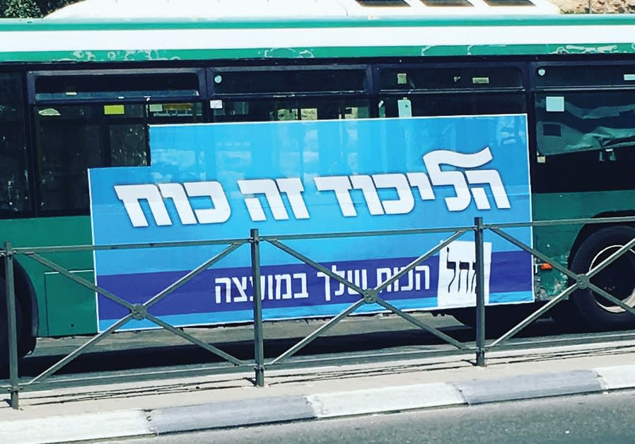 A sign on a Jerusalem bus proclaims, ‘The Likud is strength.’ Party candidate Ze’ev Elkin’s appeal in the eyes of haredim is his pledge to build as much housing as possible. Photo By: ERICA SCHACHNE A sign on a Jerusalem bus proclaims, ‘The Likud is strength.’ Party candidate Ze’ev Elkin’s appeal i