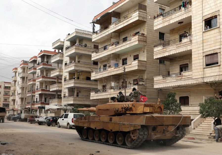 A Turkish tank rolls through the city of Afrin in northern Syria Photo By: REUTERS How Afrin overshadows eastern Syria