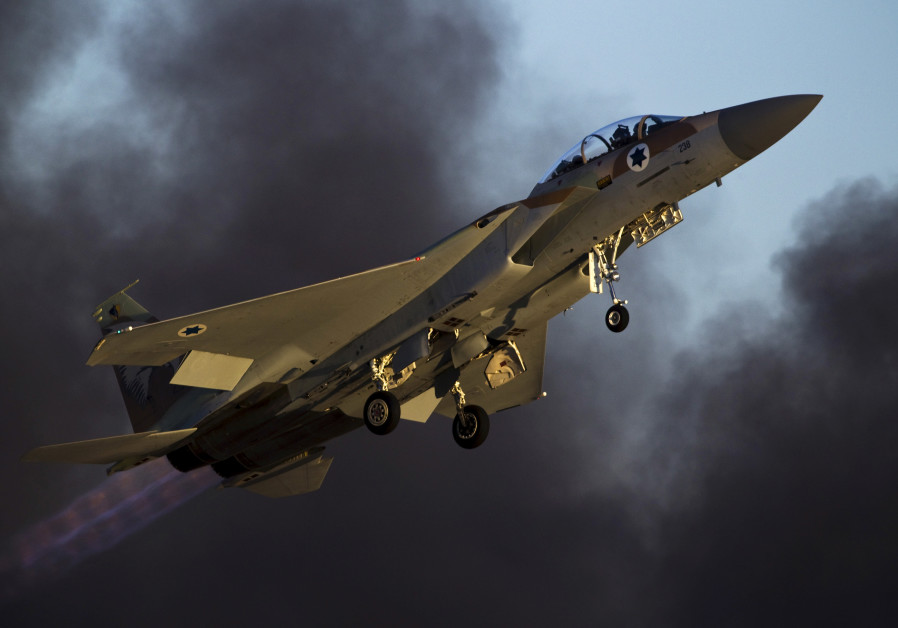 An Israeli air force F-15 fighter jet flies during an exhibition as part of the graduation ceremony of air force pilots at Hatzerim air base in southern Israel Photo By: AMIR COHEN/REUTERS An Israeli air force F-15 fighter jet flies during an exhibition as part of a graduation ceremony