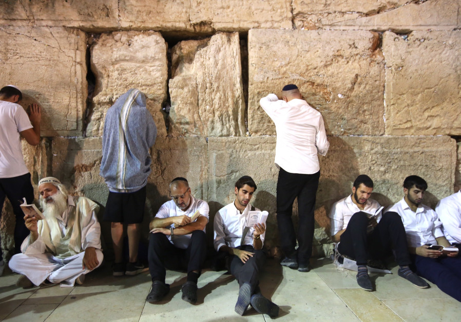 Jews praying at the Western Wall on the eve of Tisha Be'av, July 31, 2017. Photo By: MARC ISRAEL SELLEM Jews praying at the Western Wall on the eve of Tisha Be'av, July 31, 2017.