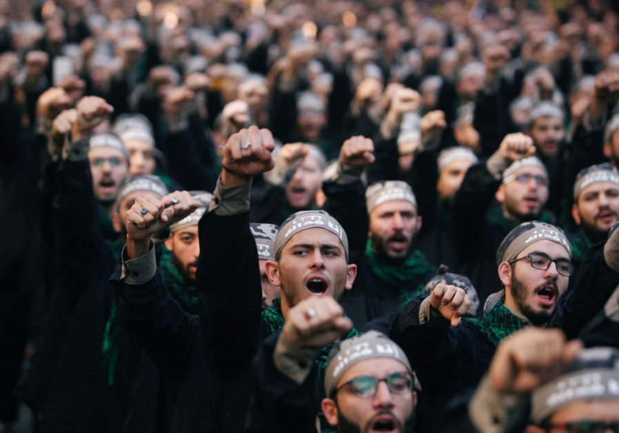 Lebanon's Hezbollah supporters chant slogans during last day of Ashura, in Beirut, Lebanon September 20, 2018 Photo By: AZIZ TAHER/REUTERS British report: UK will outlaw Hezbollah's so-called political wing