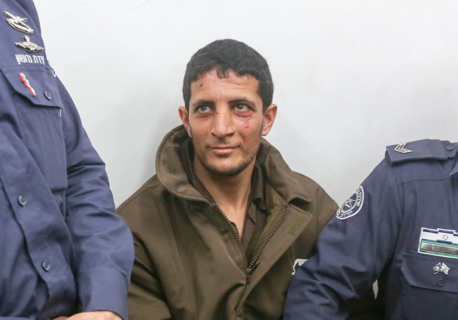 Arafat Irfaiya, Ori Ansbacher's murderer, brought to court Photo By: MARC ISRAEL SELLEM/THE JERUSALEM POST Arafat Irfaiya, Ori Ansbacher's murderer, brought to court