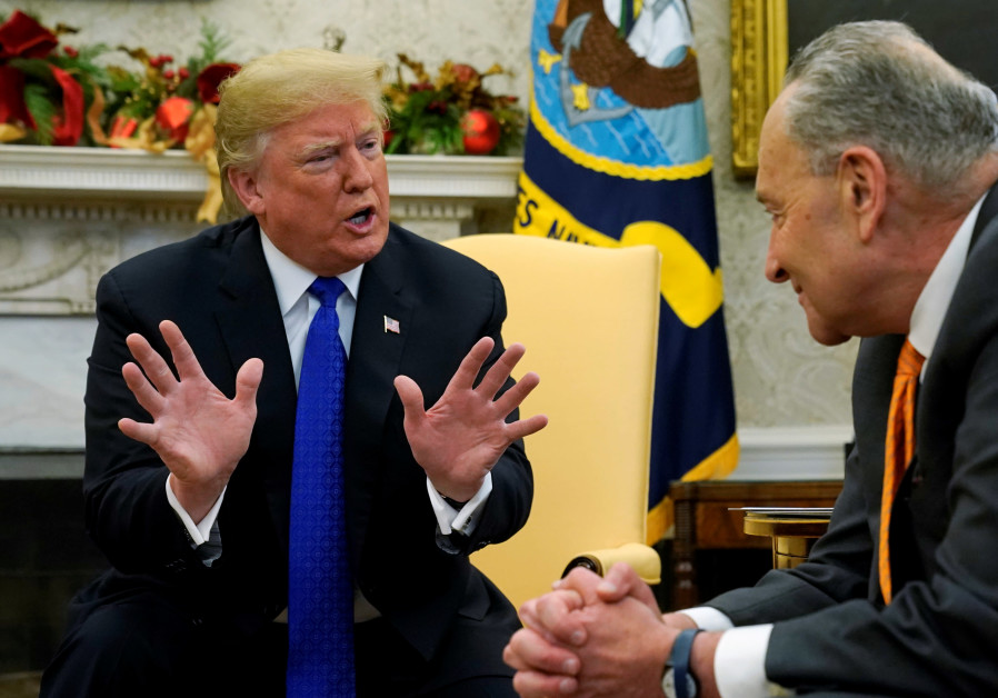 U.S. President Donald Trump speaks to Senate Minority Leader Chuck Schumer (D-NY) during a meeting with the House and Senate Democratic leadership in the Oval Office of the White House in Washington, U.S., December 11, 2018 Photo By: KEVIN LAMARQUE/REUTERS Trump declares state of emergency in bid to fund U.S.-Mexico border wall