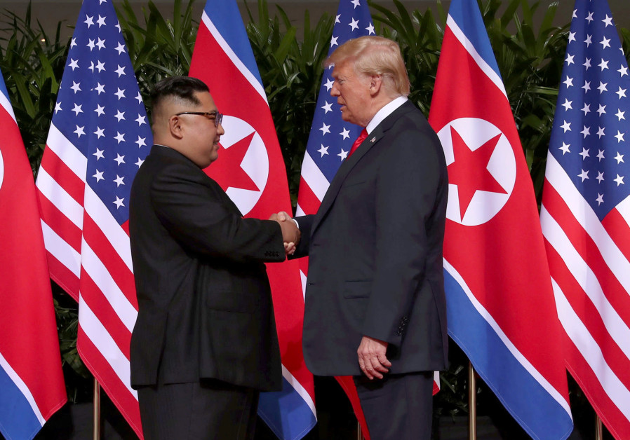 U.S. President Donald Trump and North Korea's leader Kim Jong Un walk during their summit at the Capella Hotel on Sentosa island in Singapore Photo By: ANTHONY WALLACE/POOL VIA REUTERS Trump meets N.Korea's Kim in Vietnam for second nuclear summit