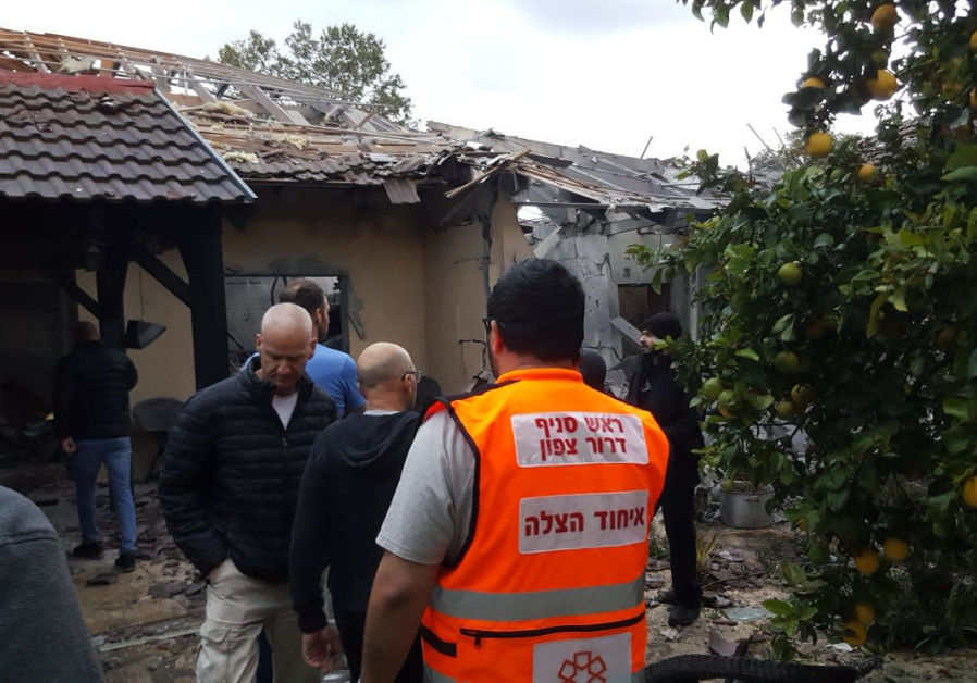 A house is taken care of by the Fire Department after being hit by rocket fire coming from the Gaza Strip, Moshav Herut, March 25, 2019. Photo By: FIRE AND RESCUE SERVICE A house is taken care of by the Fire Department after being hit by rocket fire coming from Gaza.