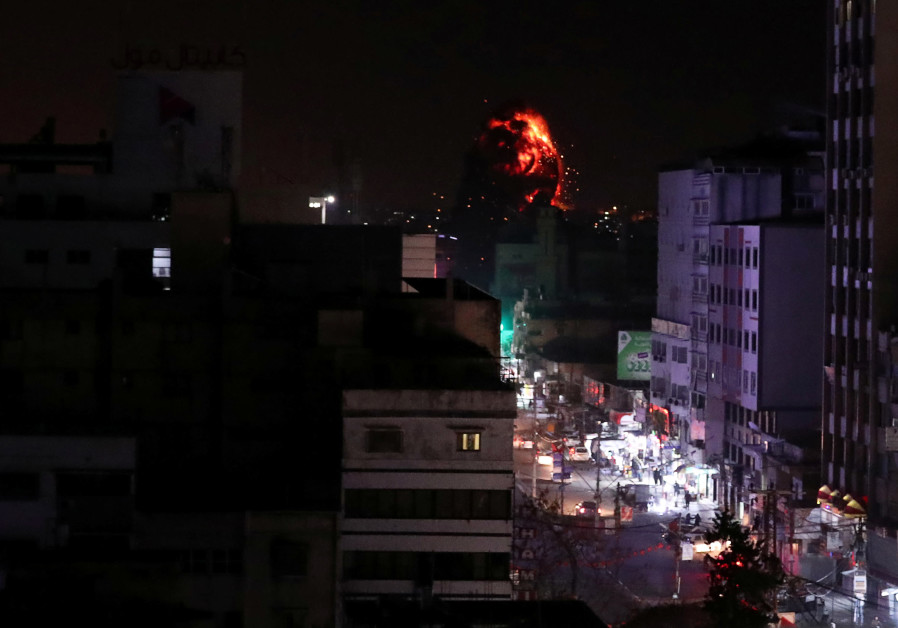 Flame and smoke are seen during an Israeli air strike in Gaza City March 25, 2019 Photo By: REUTERS/SUHAIB SALEM Flame and smoke are seen during an Israeli air strike in Gaza City March 25, 2019