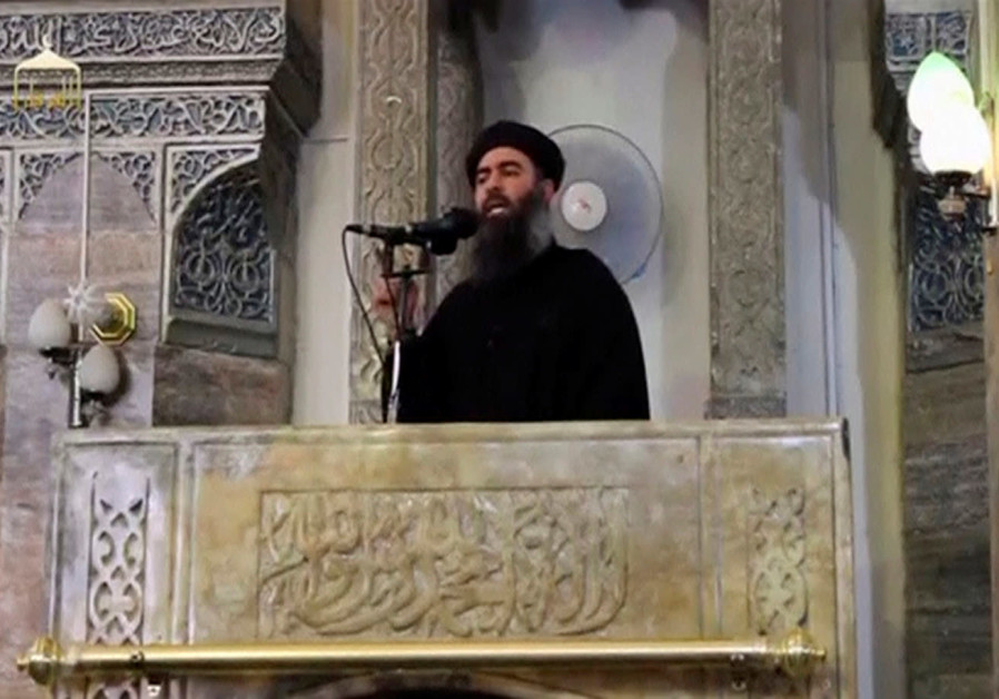 A man purported to be the reclusive leader of the militant Islamic State Abu Bakr al-Baghdadi has made what would be his first public appearance at a mosque in the centre of Iraq's second city, Mosul, according to a video recording posted on the Internet on July 5, 2014, in this still image taken fr Photo By: REUTERS FILE PHOTOS A man purported to be the reclusive leader of the militant Islamic State Abu Bakr al-Baghdadi has ma