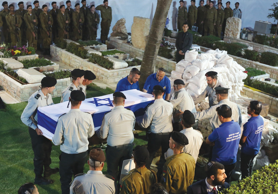 ZACHARY BAUMEL is laid to rest last week. Photo By: MARC ISRAEL SELLEM Russian official: Israel to release Syrian prisoners for remains of Baumel