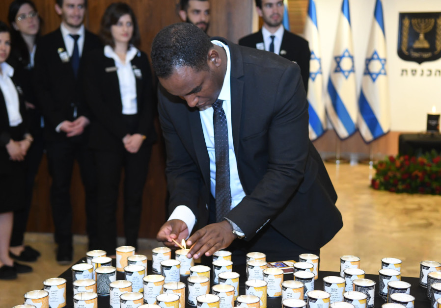 Freshman Knesset member Gadi Yevarkan lights a candle in memory of the victims of the Holocaust at the Knesset's annual “Every Person Has a Name” ceremony, May 2 2019. Photo By: KNESSET SPOKESMAN'S OFFICE Freshman Knesset member Gadi Yevarkan lights a candle in memory of the victims of the Holocaust