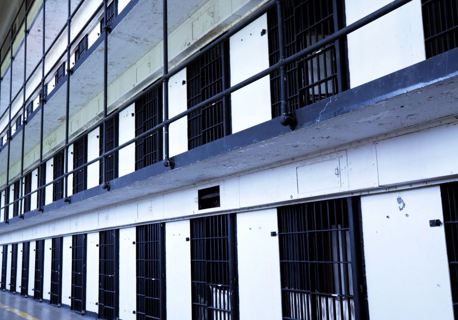 Prison Photo By: INGIMAGE Prison jail cell illustrative