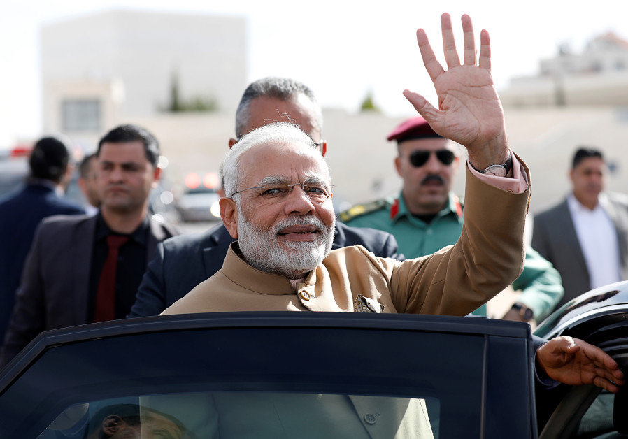 India's Prime Minister Narendra Modi waves upon his arrival to meet with Palestinian President Mahmoud Abbas (not pictured) in Ramallah, in the West Bank February 10, 2018. Photo By: REUTERS/MOHAMAD TOROKMAN India's PM Modi set to sweep to general election victory
