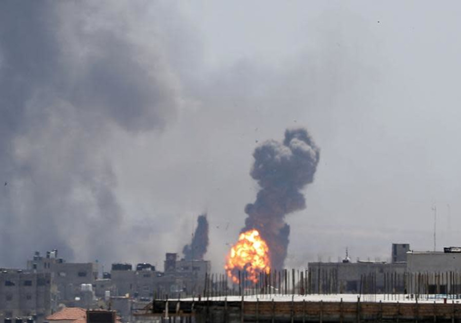 A ball of fire is seen during Israeli air strikes in Gaza May 4, 2019 Photo By: REUTERS/MOHAMMED SALEM A ball of fire is seen during Israeli air strikes in Gaza May 4, 2019