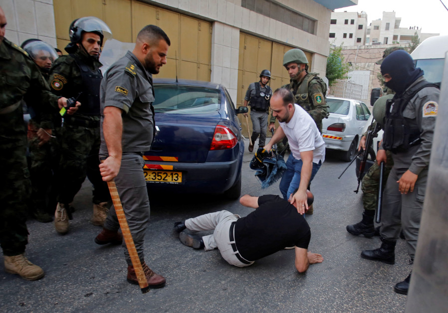 Palestinian Authority police prevent an end-of Ramadan prayer service by supporter of the Hizb-ut Tahrir in Hebron, June 4, 201 Photo By: MUSSA QAWASMA / REUTERS After threat from U.S., PA frees businessman who attended Bahrain summit