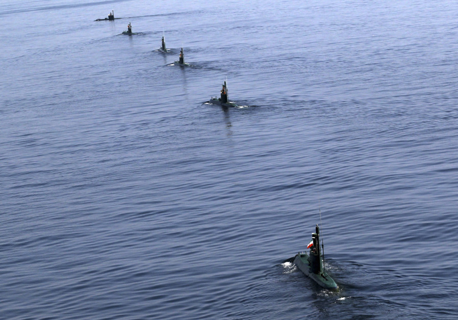 Iranian submarines participate in a naval parade on the last day of the Velayat-90 war game in the Sea of Oman near the Strait of Hormuz in southern Iran January 3, 2012 Photo By: REUTERS iran submarine