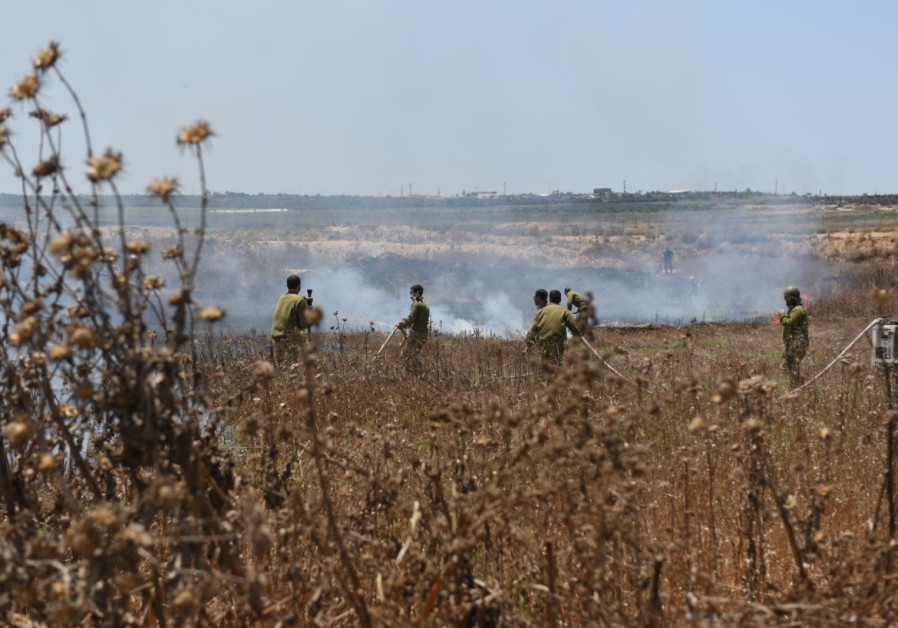 IDF firefighters extinguishing a fire in Gaza Envelope in south Israel, one of 25 fires in the region today, caused by incendiary balloons, sent by terrorists from Gaza. Gaza Envelope, Jun 27, 2019 Photo By: AVIV HERTZ/ TPS Southern residents to turn to UN to protest incendiary balloons