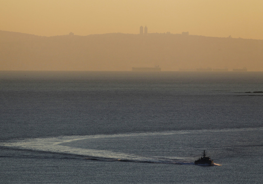 An Israeli naval vessel sails in the Mediterranean sea near the border with Lebanon, as Mount Carmel and the Israeli city of Haifa are seen in the background December 16, 2013 Photo By: REUTERS/AMIR COHEN Hezbollah preventing start of maritime border negotiations