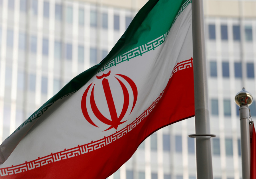 The Iranian flag flutters in front the International Atomic Energy Agency (IAEA) headquarters in Vienna, Austria March 4, 2019 Photo By: REUTERS/LEONHARD FOEGER The Iranian flag flutters in front the International Atomic Energy Agency (IAEA) headquarters in Vie