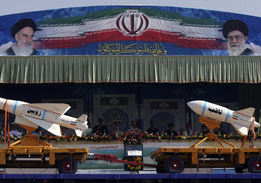 A military vehicle carrying Iranian Zoobin smart bomb (L) and Sagheb missile under pictures of Iran's Supreme Leader Ayatollah Ali Khamenei (R) and Late Leader Ayatollah Ruhollah Khomeini during a parade to commemorate the anniversary of the Iran-Iraq war (1980-88), in Tehran September 22, 2011. Photo By: REUTERS/STRINGER A military vehicle carrying Iranian Zoobin smart bomb (L) and Sagheb missile under pictures of Iran'