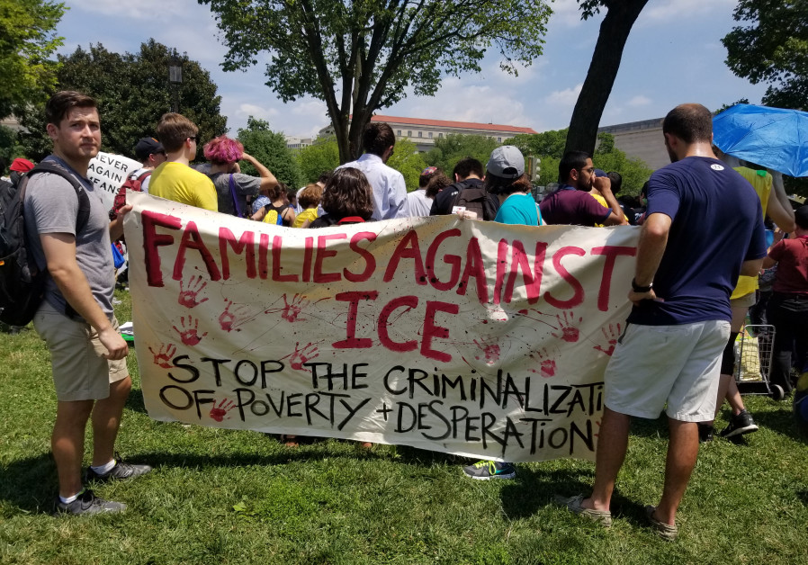 People hold signs 'Families against ICE' at immigration protest Photo By: OMRI NAHMIAS Jews protest Trump's immigration policy: 'This is the time to take action’
