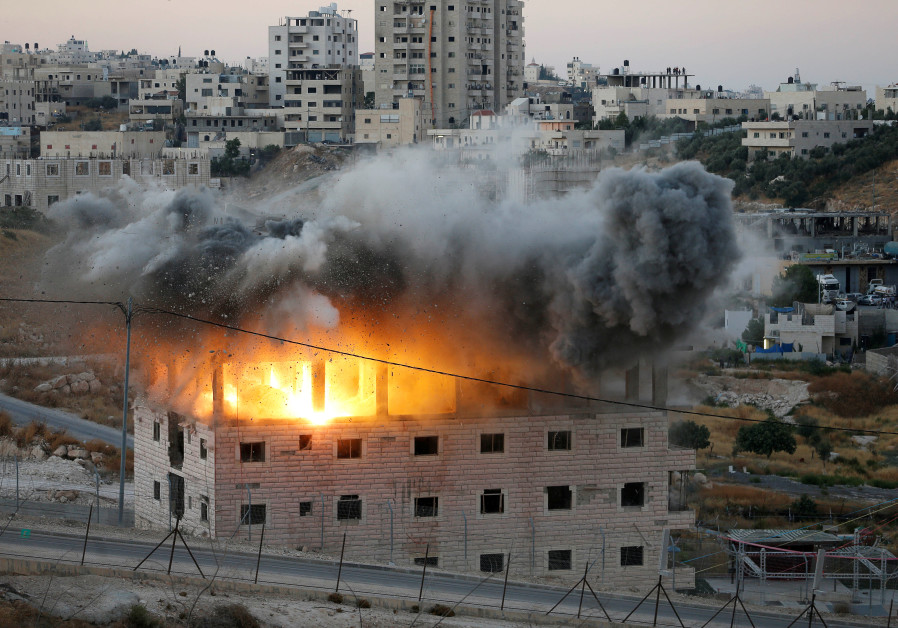 A Palestinian building is demolished by Israeli forces in Wadi Hummus, which sits on either side of the Israeli barrier just outside of Jerusalem in the West Bank July 22, 2019 Photo By: REUTERS/MUSSA QAWASMA A Palestinian building is demolished by Israeli forces in Wadi Hummus, which sits on either side of