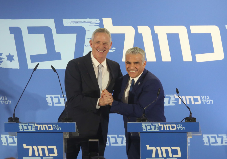 Blue and White leaders Benny Gantz (L) and Yair Lapid (R) embrace during a campaign event, February 21st, 2019 Photo By: MARC ISRAEL SELLEM/THE JERUSALEM POST Blue and White leaders Benny Gantz (L) and Yair Lapid (R) embrace