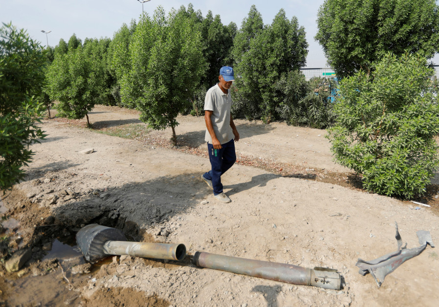 A man glances at a rocket that flew away from an Iraqi militia group's weapons depot after it caught fire, in Baghdad, Iraq, August 13, 2019 Photo By: KHALID AL MOUSILY / REUTERS Could US forces be targeted amid Iran-Israel tensions in Iraq?